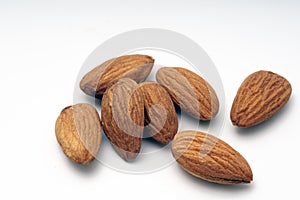 Pile of almonds on a white background