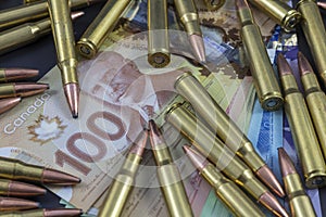 Pile of ammo on Canadian Money