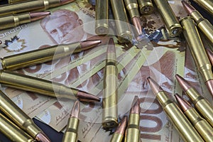 Pile of ammo on Canadian Money