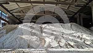 Pile of ammonium sulfate powder inside a warehouse of chemical plant
