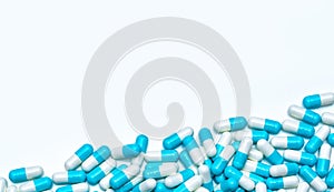 Pile of antibiotic capsule pills isolated on white background. Global market trends of antimicrobial drugs concept. Antibiotic