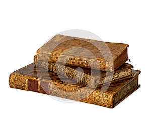 Pile of antique books with a leather cover and golden ornaments on white