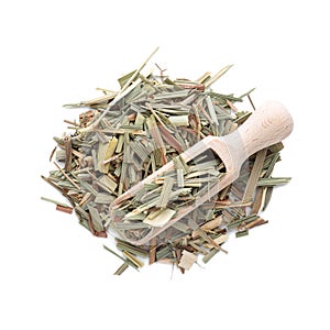 Pile of aromatic dried lemongrass and wooden scoop isolated on white, top view