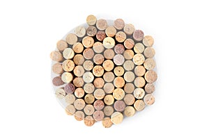 Pile of assorted used wine corks in shape of circle isolated on white background. Close up top view.