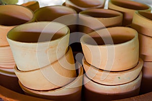 Pile of baked clay cups in workshop