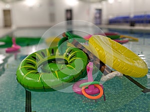 A pile of Beach and pool inflatables floating in the swimming water