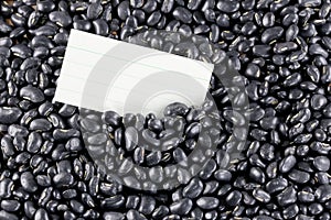 Pile black beans and note paper.