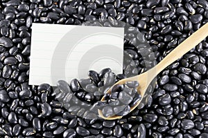 Pile black beans and note paper.