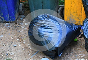 Pile black garbage bag roadside in the city close up