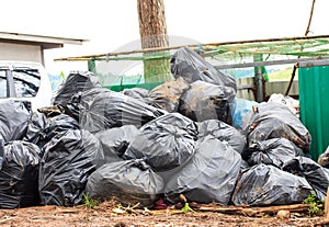 Pile of black garbage bags with tons of trash