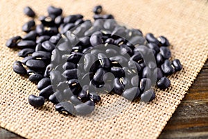 Pile of black kidney beans on gunnysack