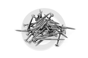 Pile of black screws isolated on white background
