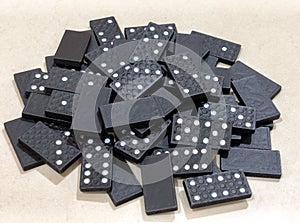 Pile of Black Wooden Domino Pieces Gathered