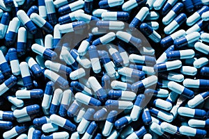 Pile of blue capsules