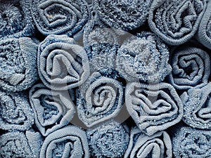 Pile of  blue cotton towels for sale