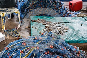 Nets and caught fish on a boat deck