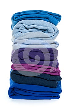 Pile of blue and purple folded clothes photo