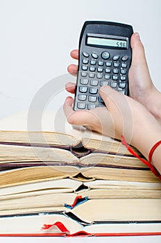 Pile of books and calculator