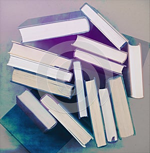 Pile of books on end with colorful texture