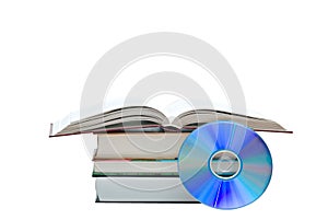 Pile of books, open book, and DVD disk