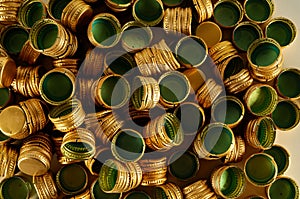 Pile of bottle metal caps as pattern background,