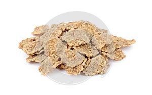 Pile of bran flakes on white background, closeup. Healthy breakfast cereal