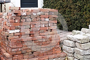 The pile of bricks and the pile of stones will be used in construction.