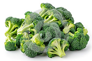 A Pile of Broccoli Florets on a White Surface Fresh broccoli florets arranged neatly on a clean white surface