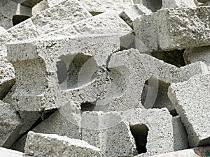 Pile of broken concrete bricks ready to be recycled on a construction and demolition waste management site