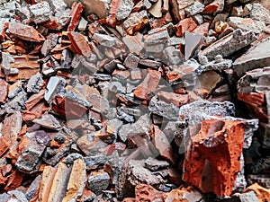 Pile of Broken red brick and concrete close up details - destruction concept