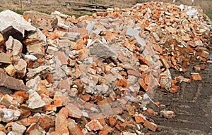 Pile of broken red bricks. Building bricks. Construction debris