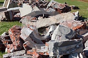 Pile of broken red bricks on construction site, garbage