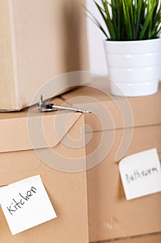 Pile of brown cardboard boxes with house or office goods