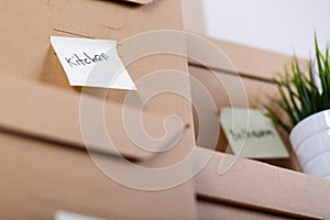 Pile of brown cardboard boxes with house or office goods