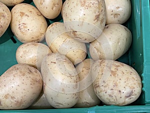 Pile of brown potato in the market.