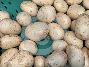 Pile of brown potato in the market.