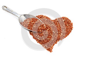 Pile of brown rice in heart shape