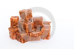 Pile of brown sugar cube shape on white background/.