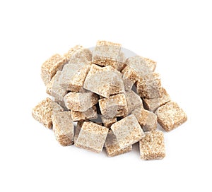 Pile of brown sugar cubes isolated