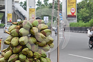 pile or bunch of coconuts on the cart at road for sells