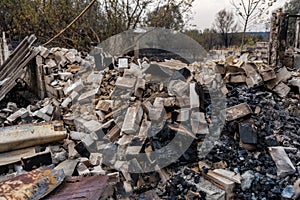 Pile of burnt bricks from a destroyed house after the fire