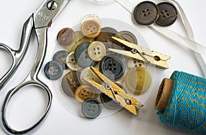 Pile of Buttons with Sewing Materials and Clothes Pins Isolated