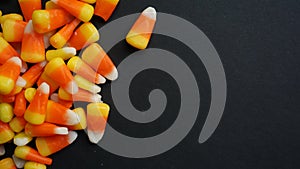 Pile of candy corn on a black background