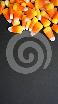 Pile of candy corn on a black background