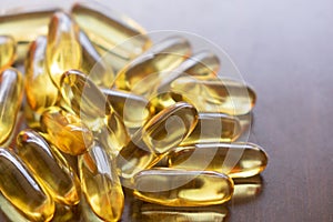 Pile of capsules Omega 3 on white background. Close up, top view, high resolution product.