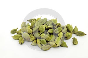 Pile of cardamom or cardamon seeds spice isolated on white background.