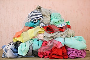 Pile of carelessly scattered clothes photo