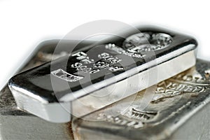 Pile cast silver bullion on a white background. photo