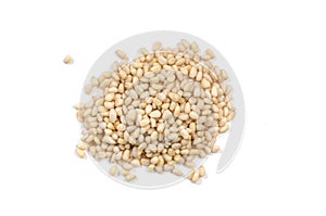 Pile of cedar nuts on white backgound