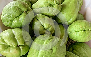 Pile of chayote Sechium edule on the vegetable market